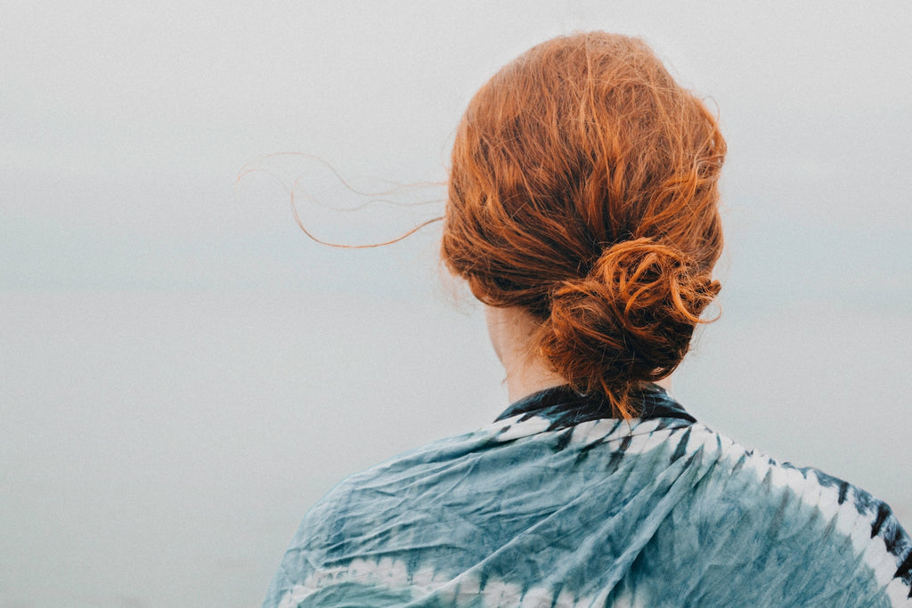 woman with hair tied into a bun