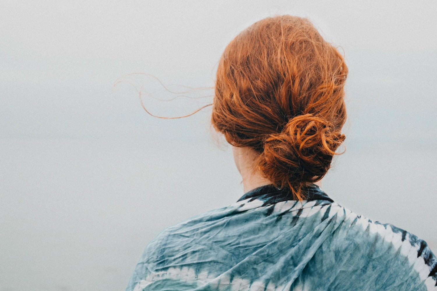woman with hair tied into a bun